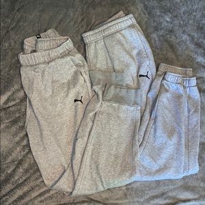 Two pairs of puma sweatpants